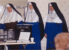 Sister Mary Providencia, Reverend Mother, and Sister Mary Philomena in full tune while being directed by Sister Mary Bernadette out of the picture